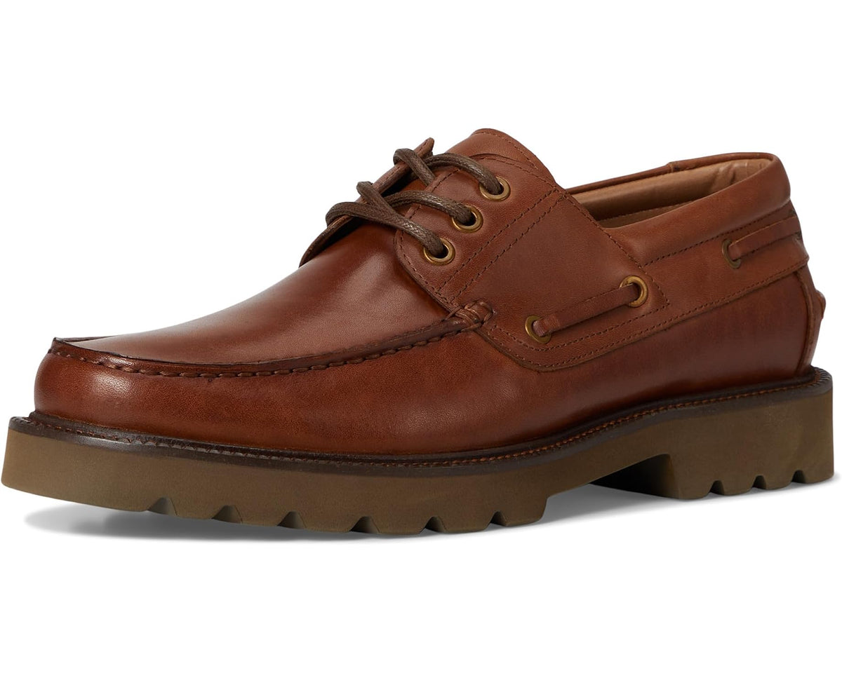 Men's tan leather boat shoe front view with lace-up eyelets and lug rubber sole