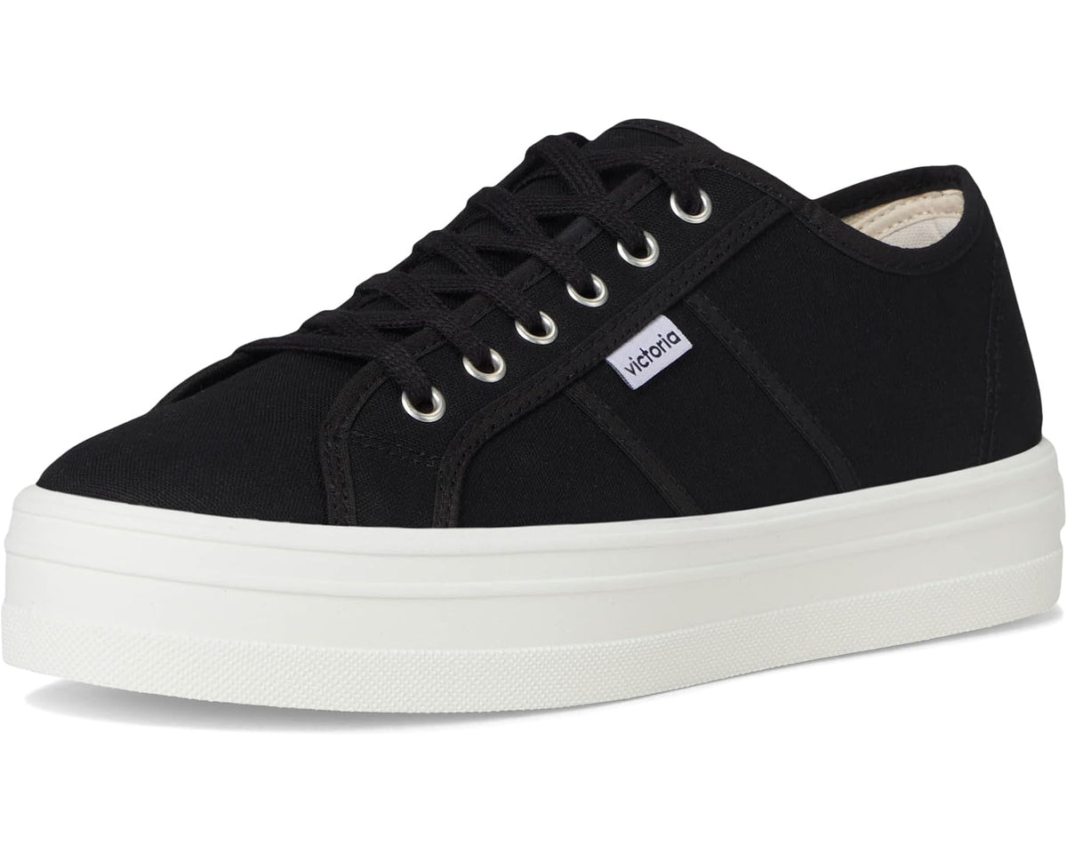 Black canvas low-top sneakers with lace-up front and white platform sole