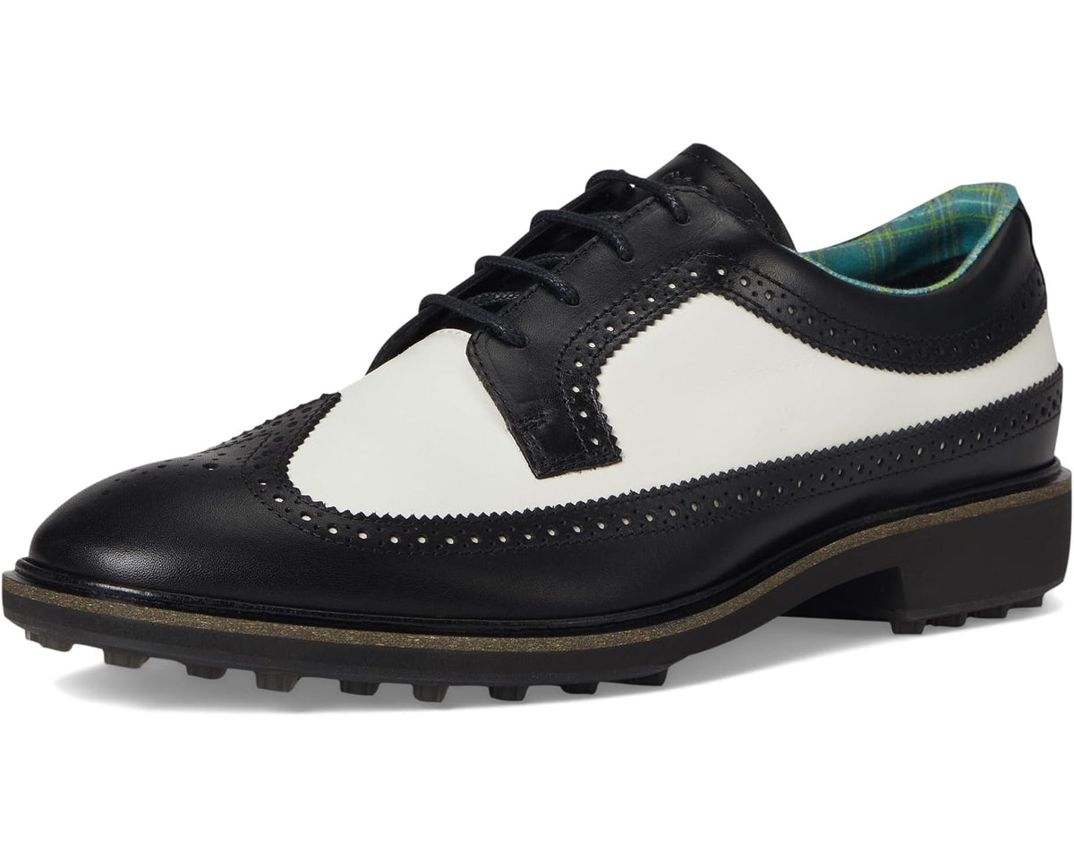 Men's ECCO wingtip golf shoe front view, black and white leather with lace-up vamp