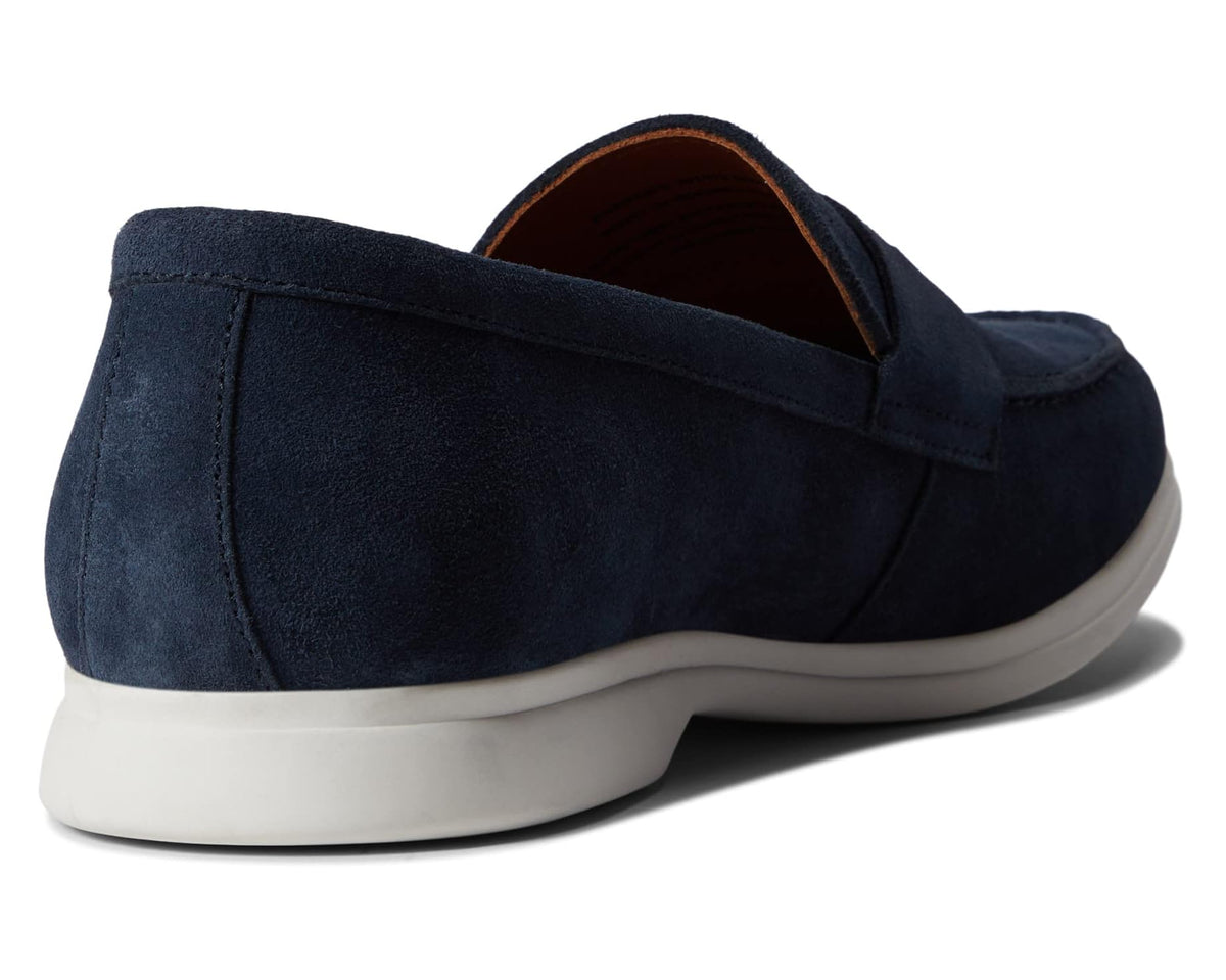 Navy suede loafer with rear seam, cushioned collar, and white rubber outsole