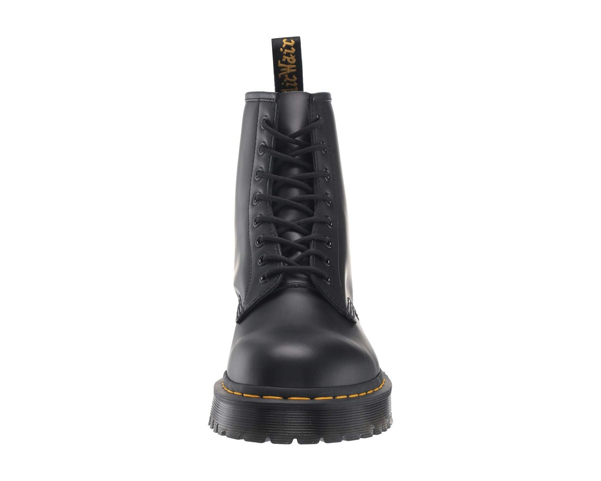 Black smooth leather lace-up boots with raised toe and yellow welt stitching, boot height