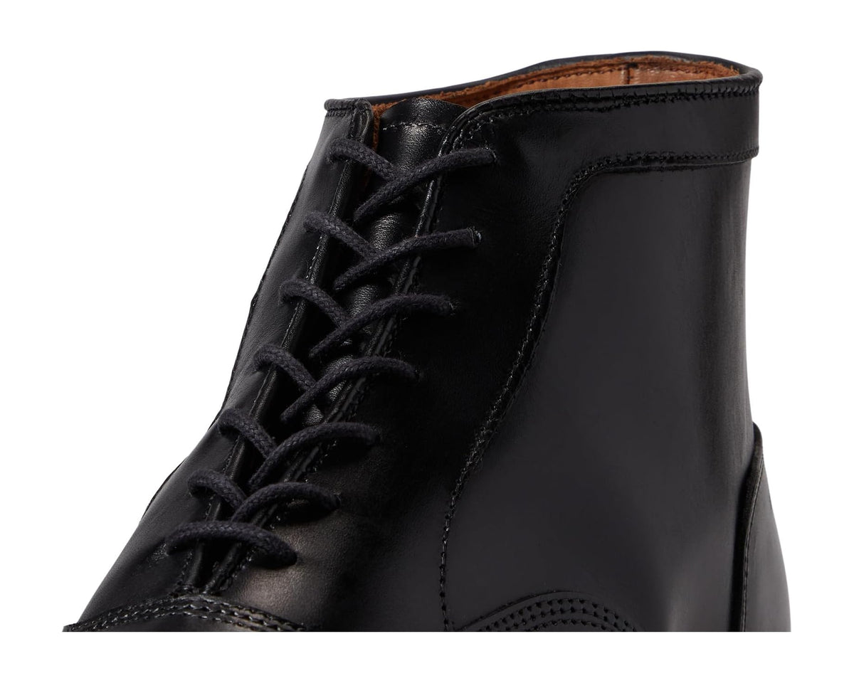 Close-up of black leather lace-up boot with eyelets and padded collar