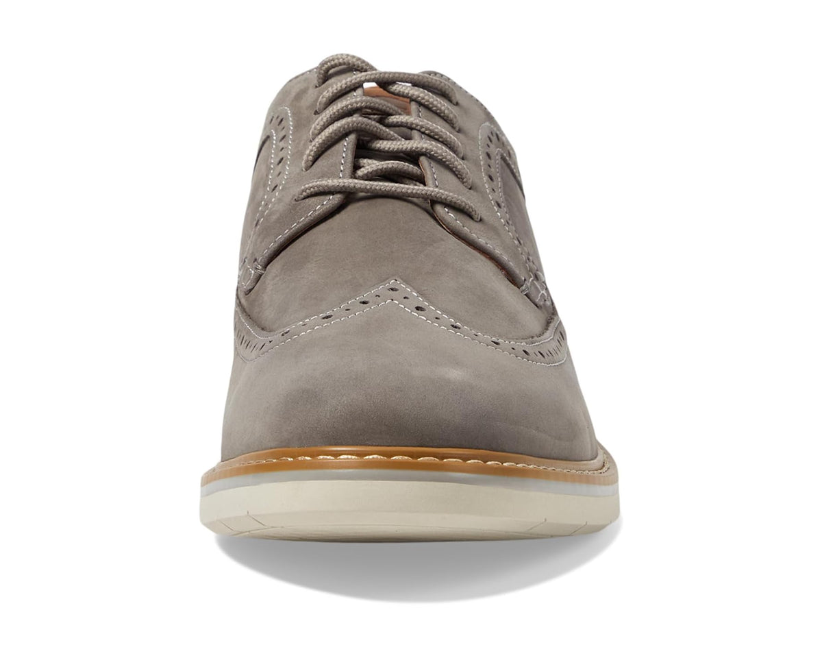 Gray nubuck lace-up oxford shoe with stitched toe and cushioned tongue.