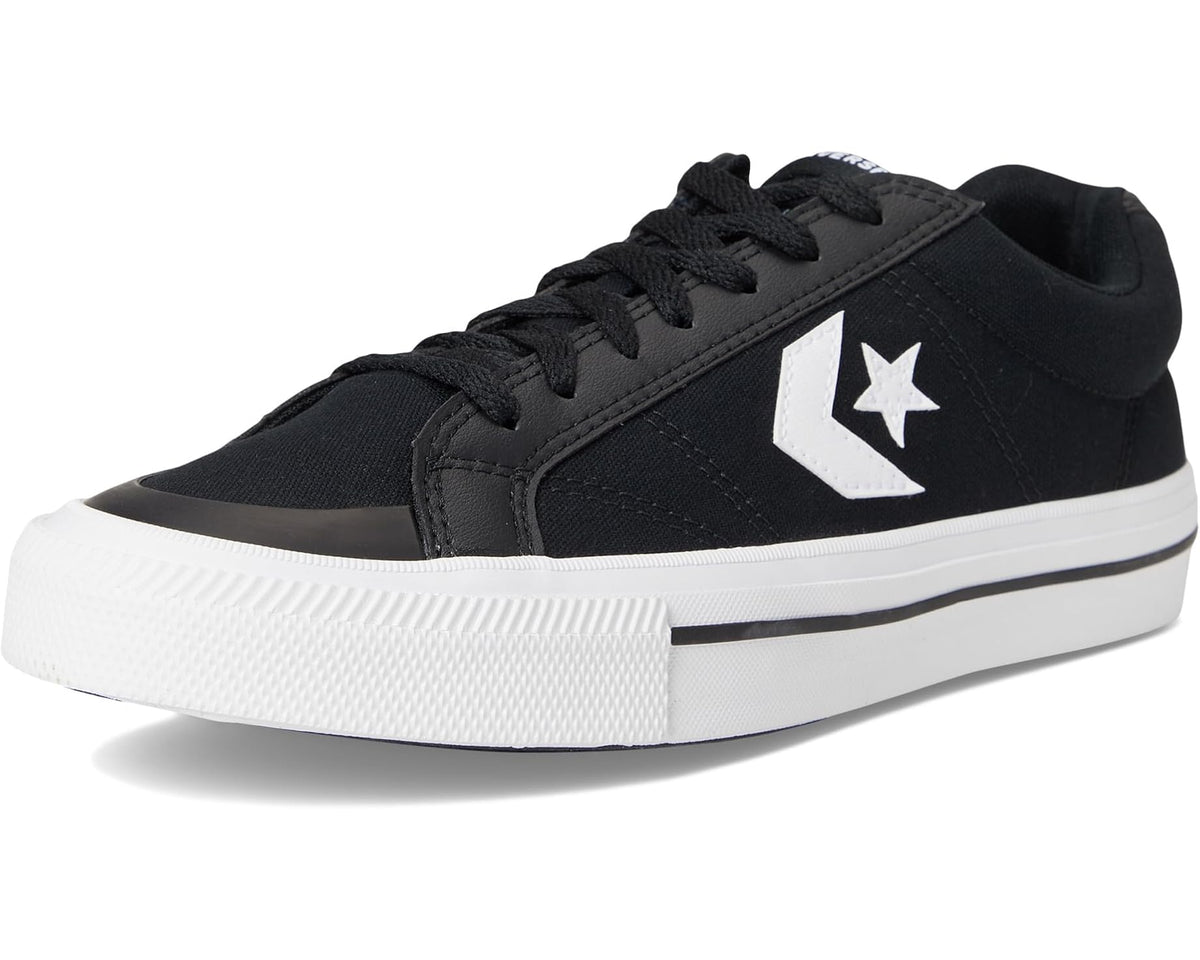 Black and white Converse low-top sneaker with lace-up front and side star patch