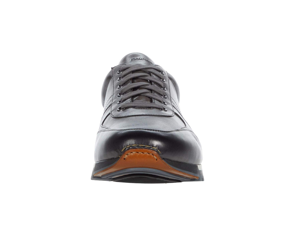 Dark grey leather lace-up sneaker front view with lace eyelets and thick sole
