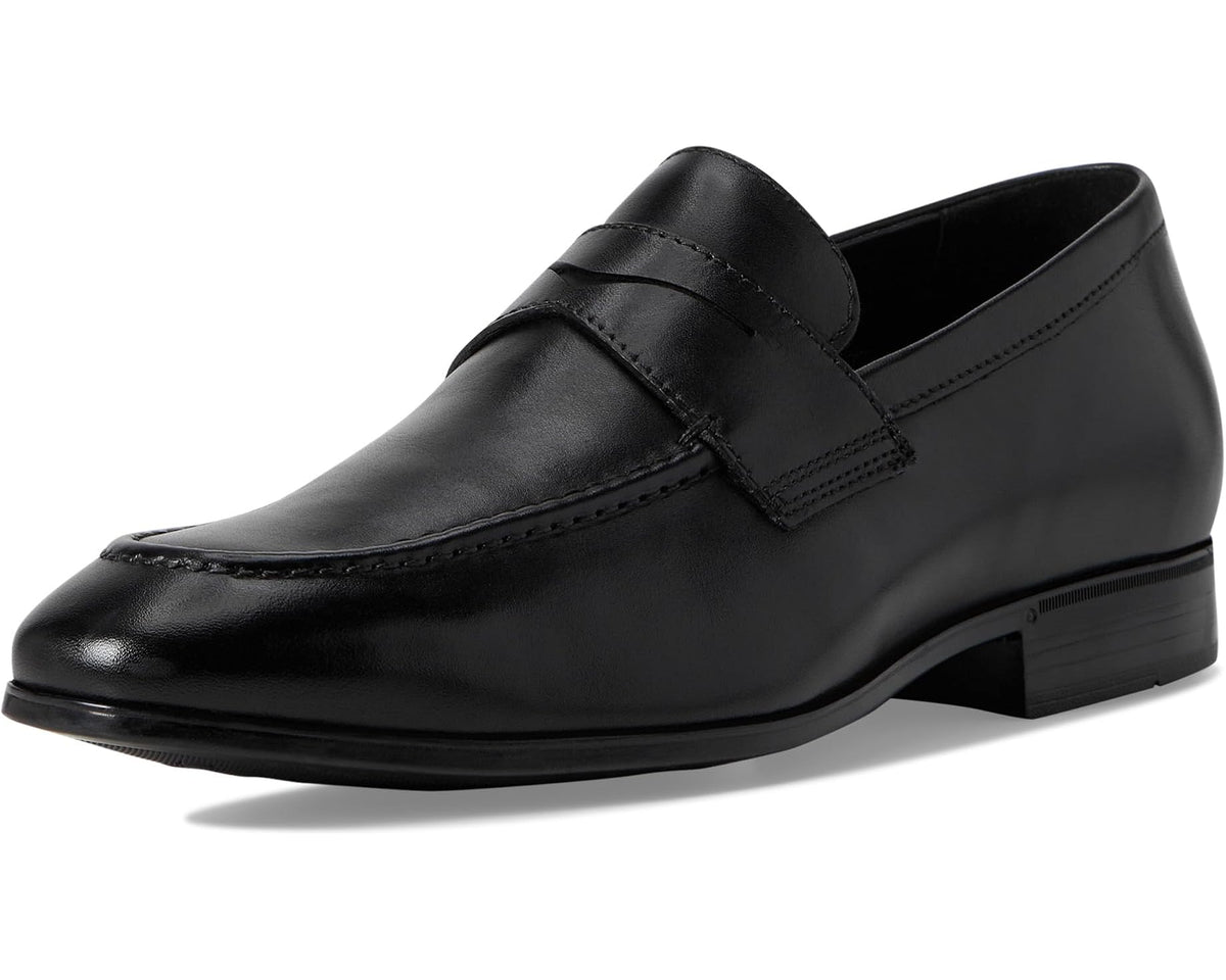 Black leather penny loafer side profile with moc stitching and low stacked heel