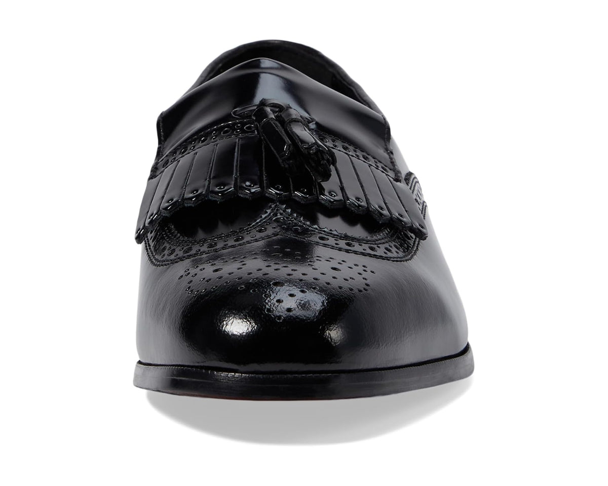 Black leather wingtip tassel slip-on dress shoe, front toe view