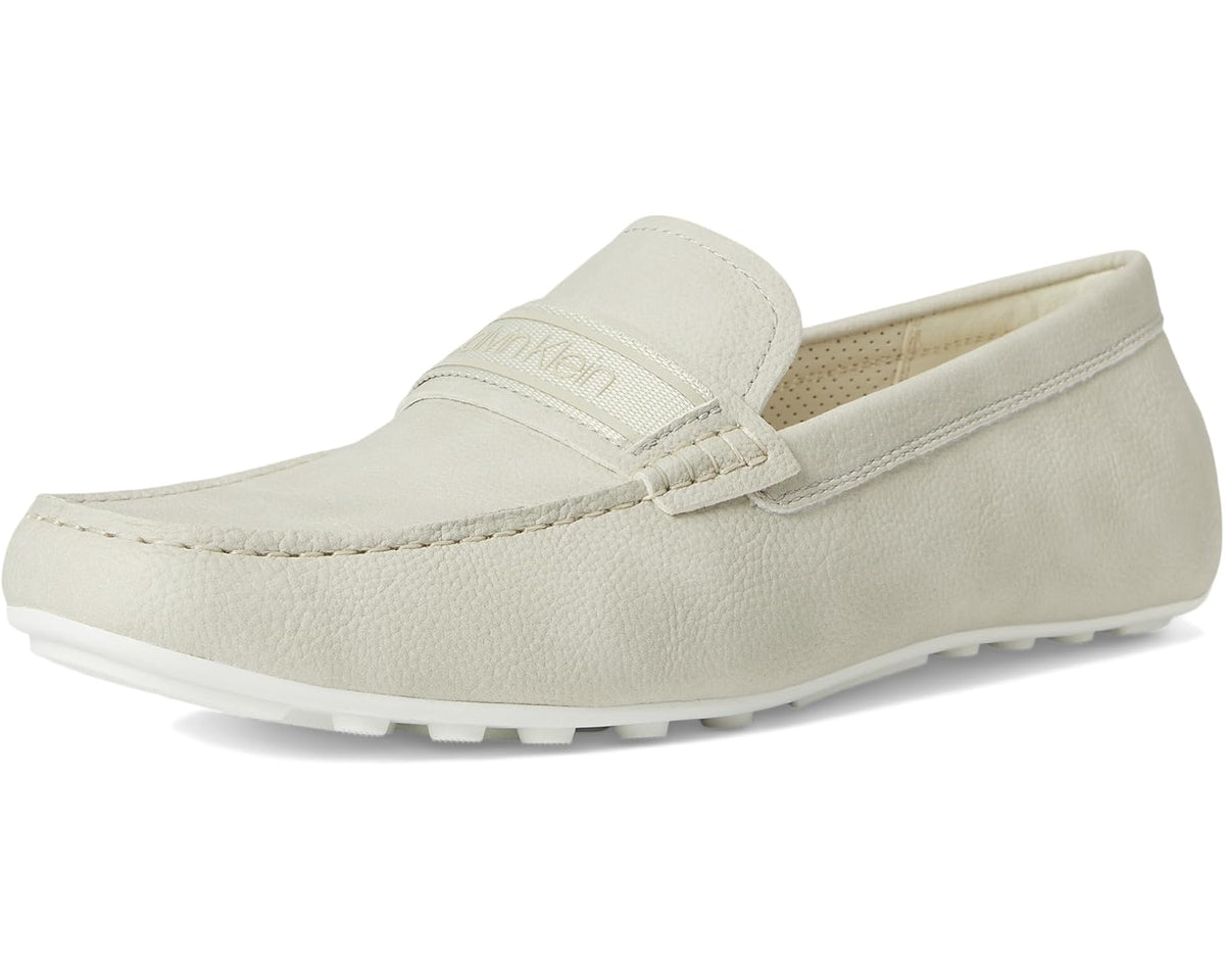 Light-colored slip-on loafer with stitched strap detail and rubber sole
