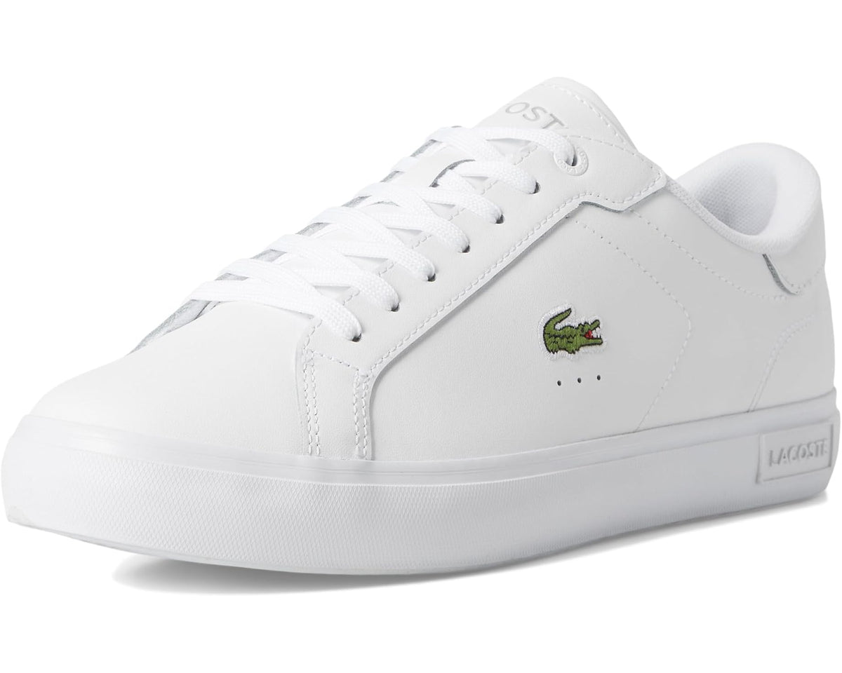 White Lacoste sneakers with green crocodile logo, stitched toe cap and lace-up front