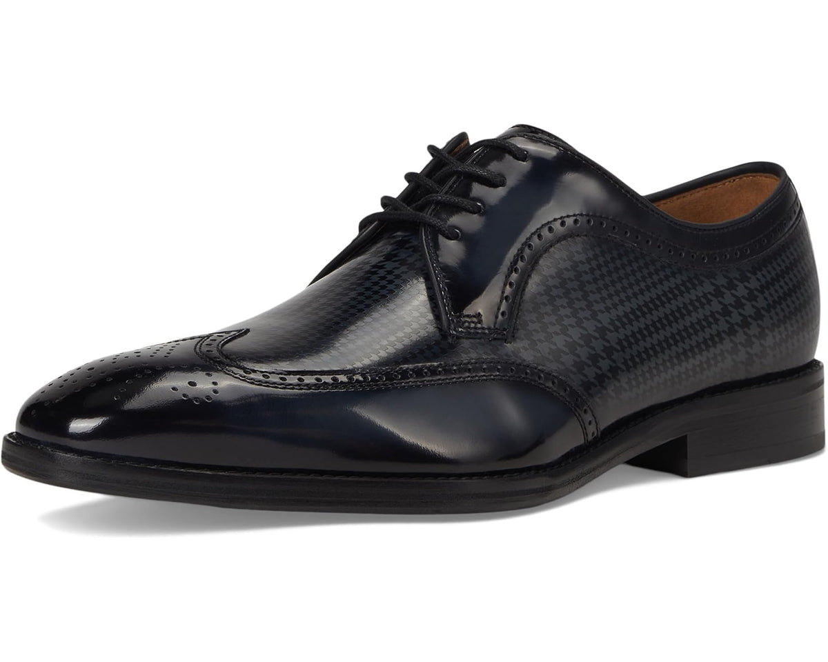 Black wingtip oxford lace-up shoes with glossy finish and houndstooth calfskin pattern.