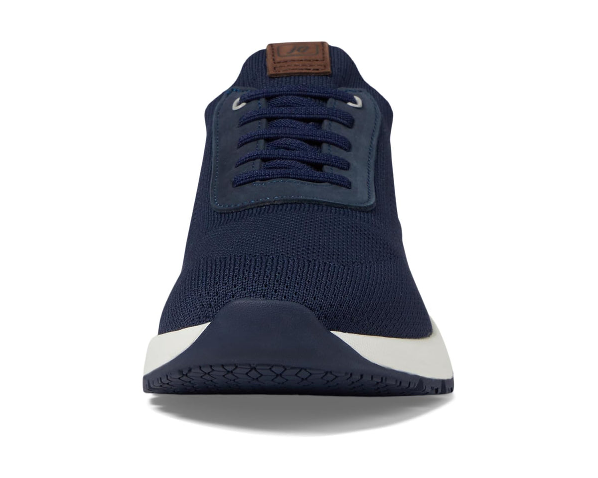 Navy knit sneaker with brown logo patch on the tongue and lace-up front