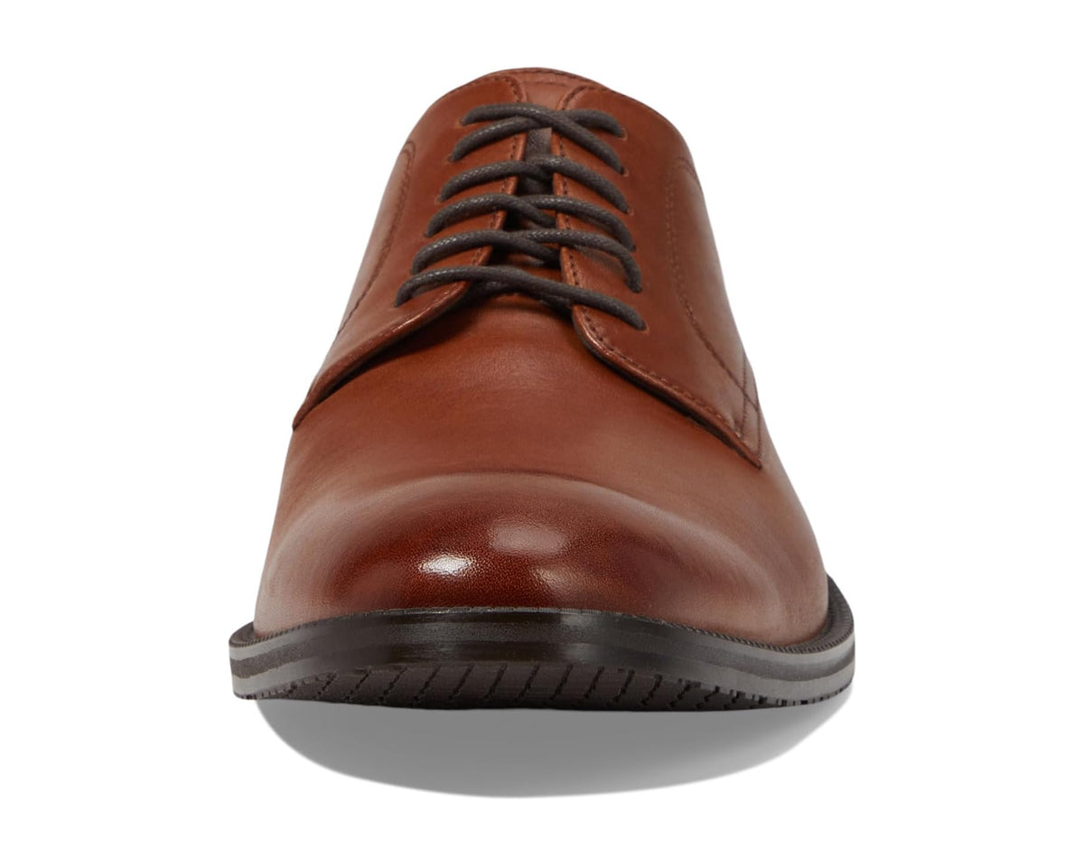 Men's tan oxford shoes front view with glossy leather finish and lace-up eyelets