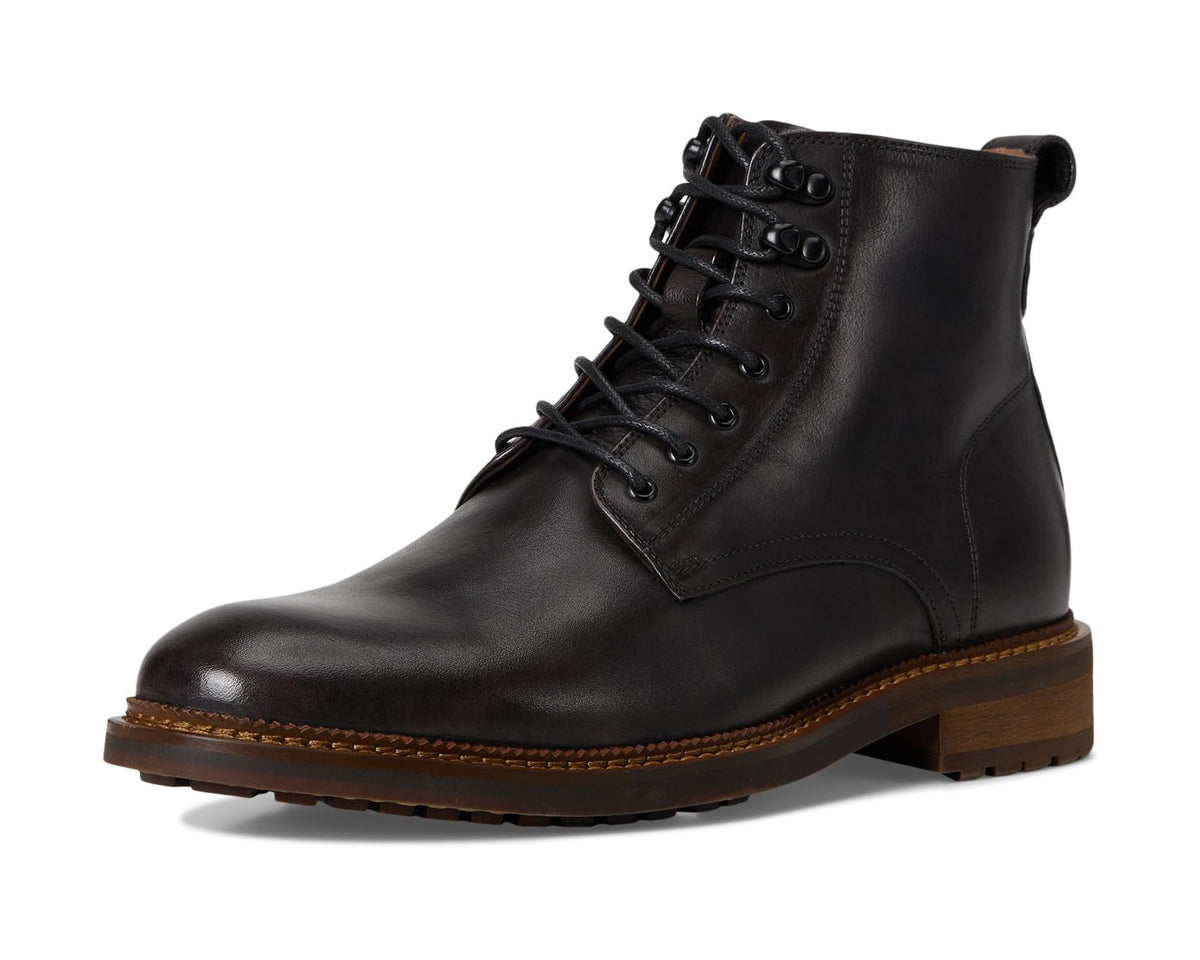 Black lace-up ankle boots with cushioned collar and rugged brown sole