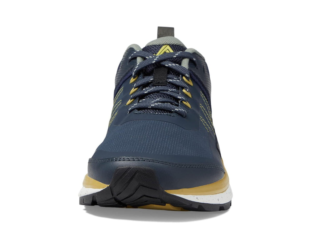 Navy low-cut trail shoe with lace-up front, cushioned collar, and yellow heel