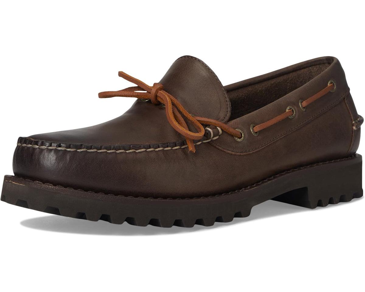 Dark brown leather boat shoe with tan laces, moc toe, and chunky tread sole
