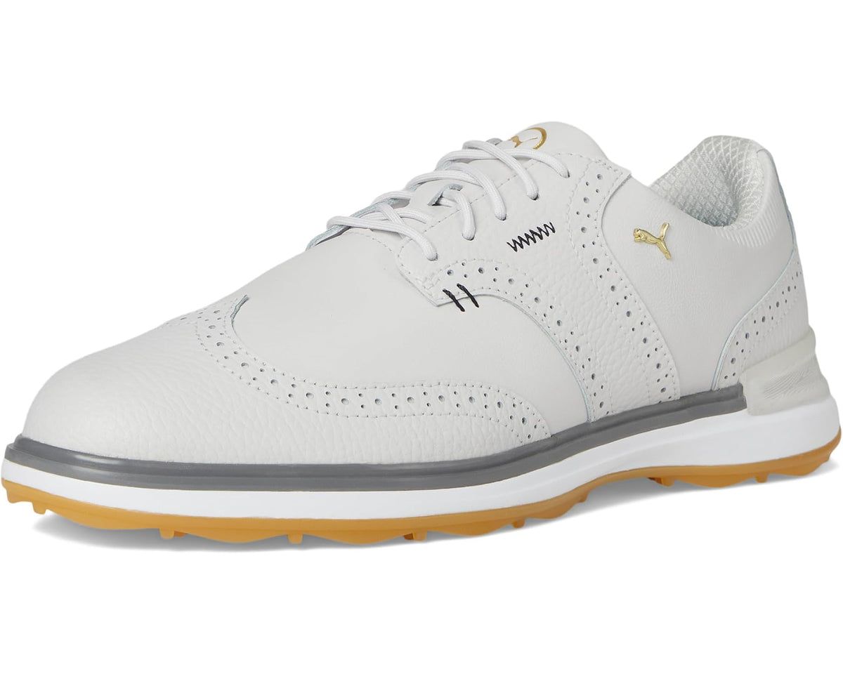 Front three-quarter view: men's white golf sneakers with perforations and gum sole