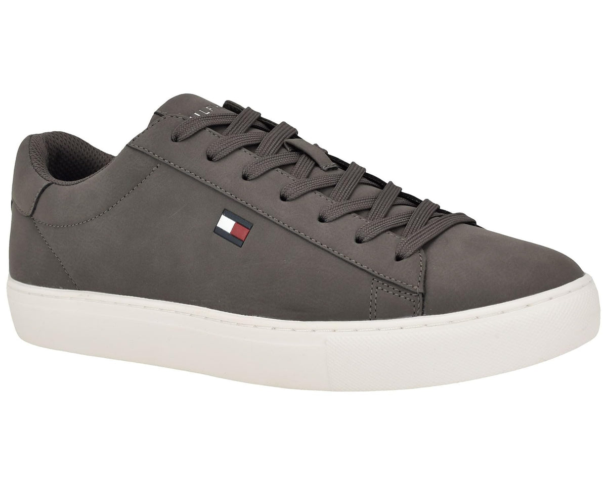 Grey lace-up low-top sneakers with flat white sole and side flag patch