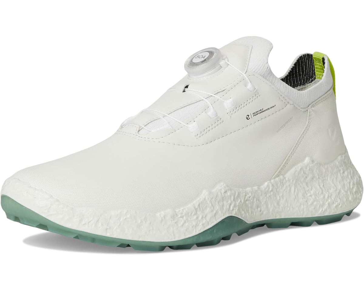 White waterproof golf shoe front three-quarter view with BOA dial and green outsole