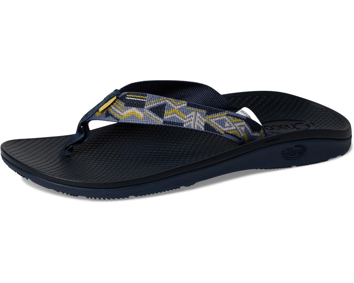 Men's navy flip-flop sandals angled view with patterned strap on dark textured footbed