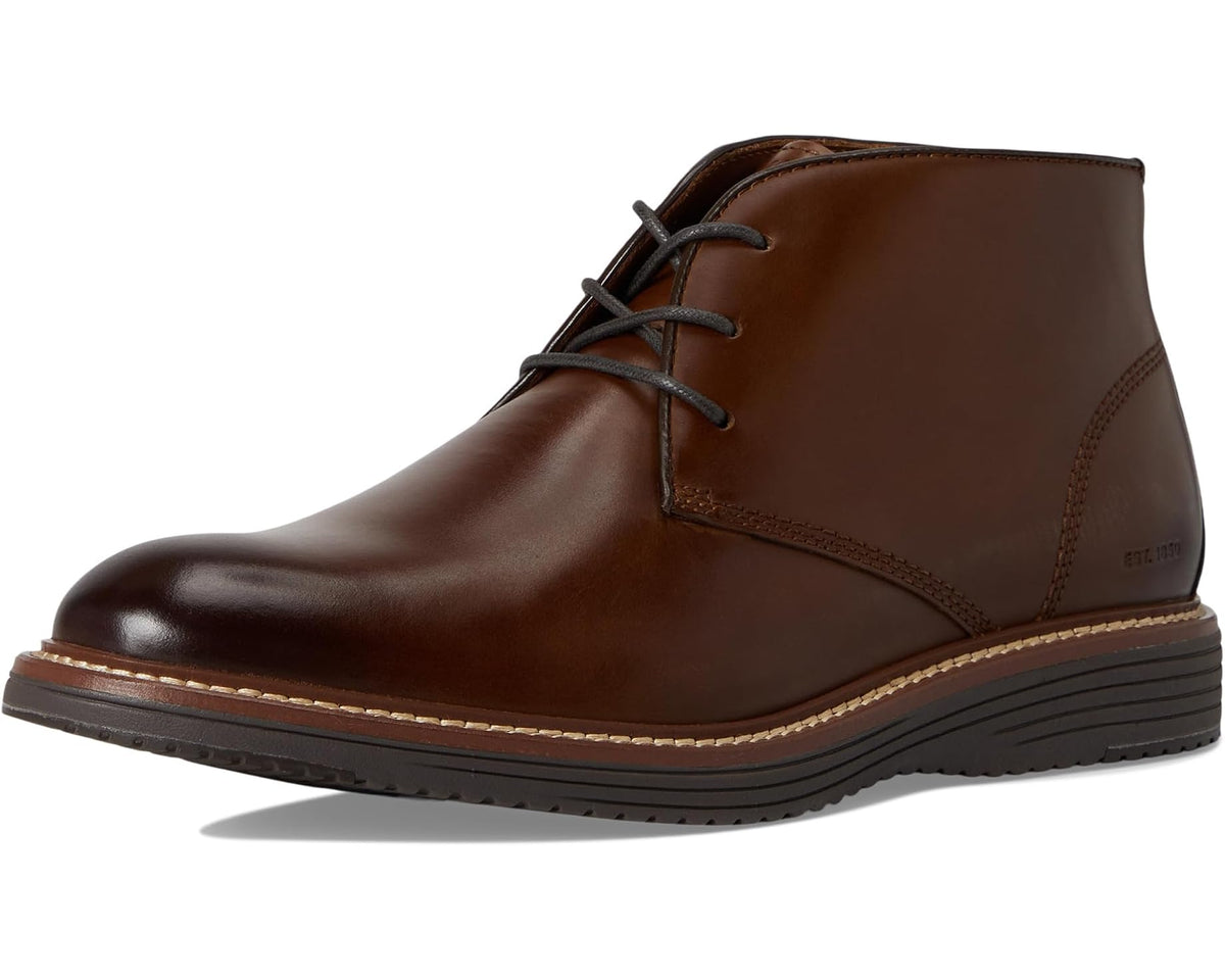 Tan leather chukka boot front quarter view with lace-up and side stitching