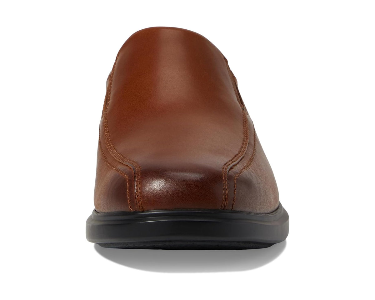 Men's tan leather slip-on shoes, rear view with black outsole