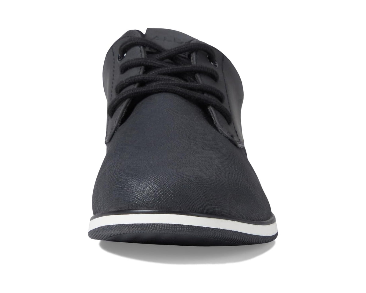 Black low-top lace-up sneakers with smooth toe and white sole trim