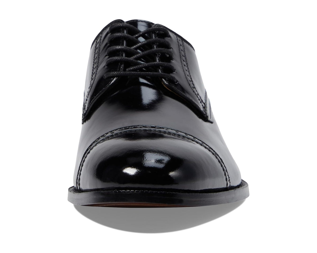 Black cap-toe Oxford dress shoe front view with lace-up and high-gloss finish