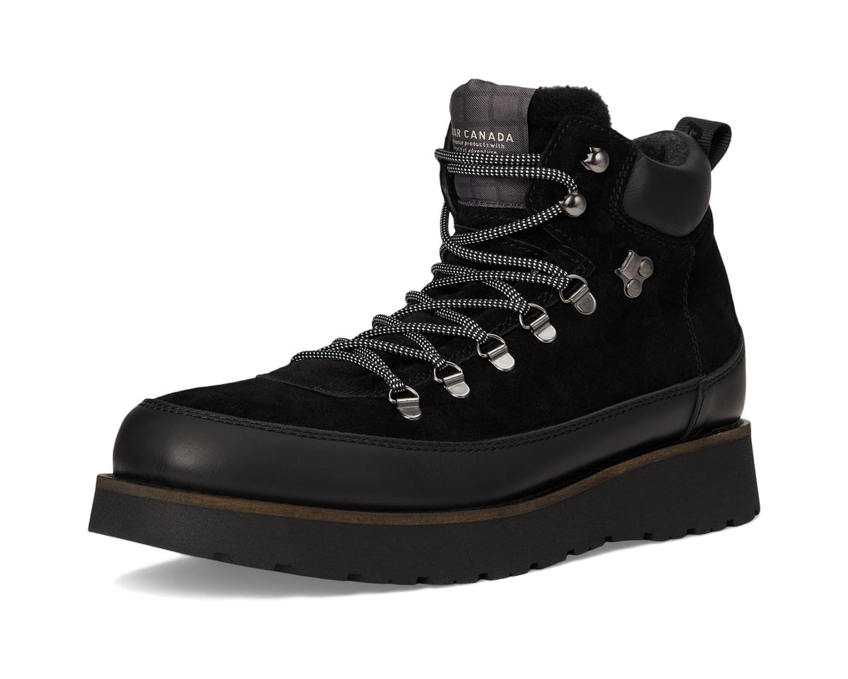 Black high-top lace-up boots with fur lining and chunky rubber outsole