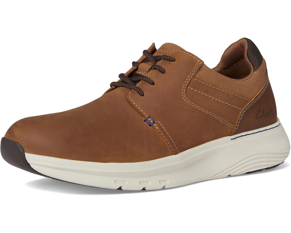 Men's dark tan leather lace-up sneaker front side, plain toe, and white sole
