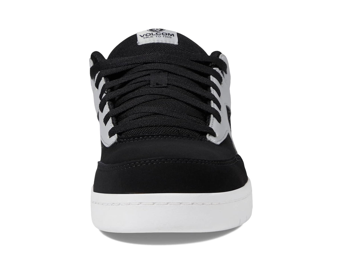 Black low-top sneaker from above with lace-up and white midsole