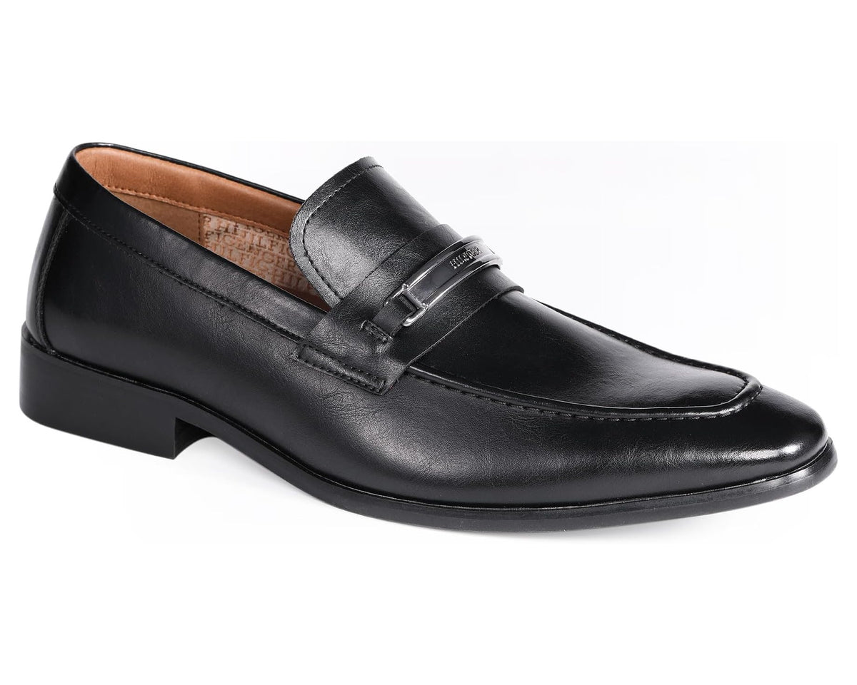 Black leather loafer with strap buckle, tan lining, and low block heel