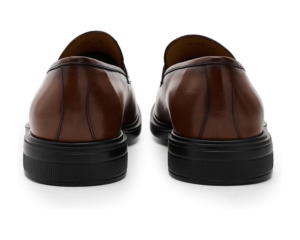 Back view of brown leather loafers with black rubber heel and outsole