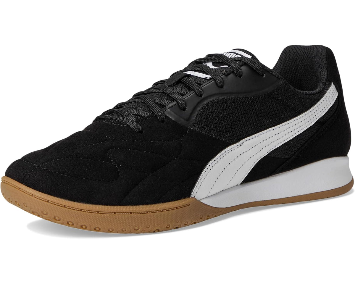 Men's indoor soccer trainer shoes, black upper, white Puma stripe, and gum outsole
