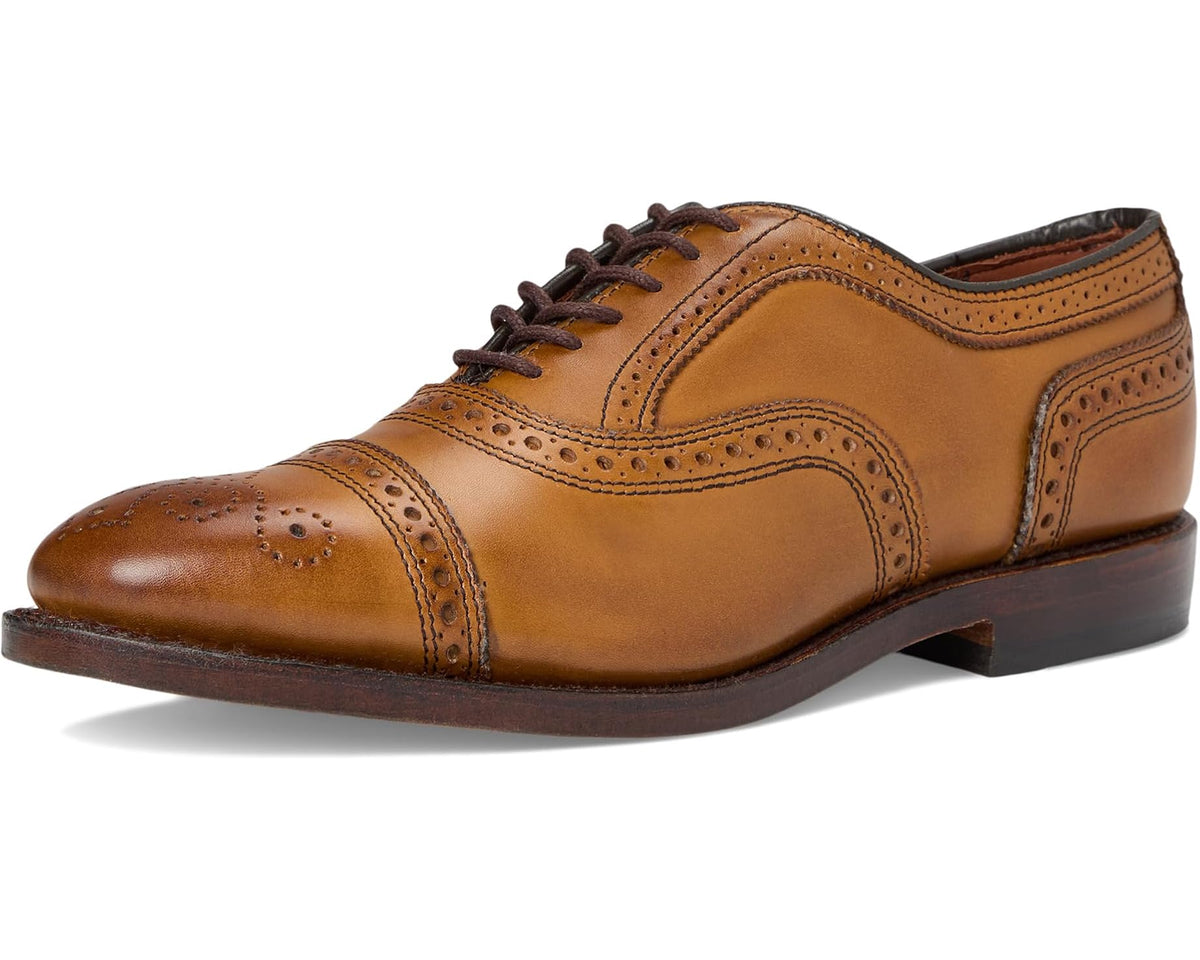 Men's walnut-brown leather oxford shoe front view with brogue detailing