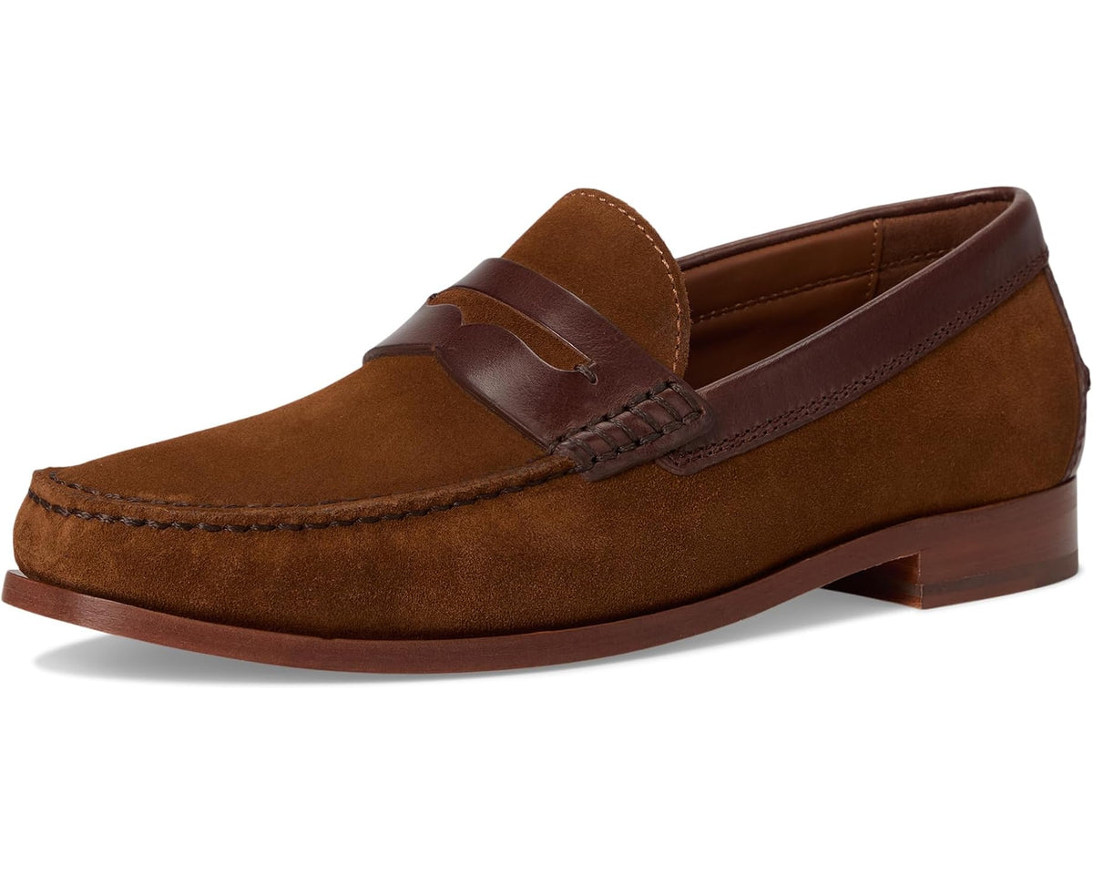 Side view of brown suede penny loafer with leather keeper strap and apron stitching