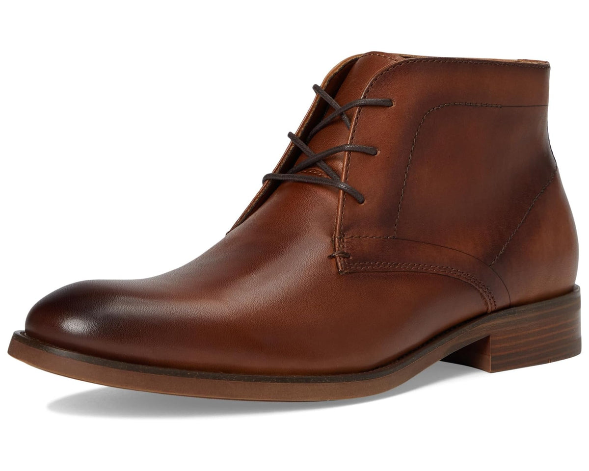 Tan leather lace-up chukka boot with padded collar and low stacked heel