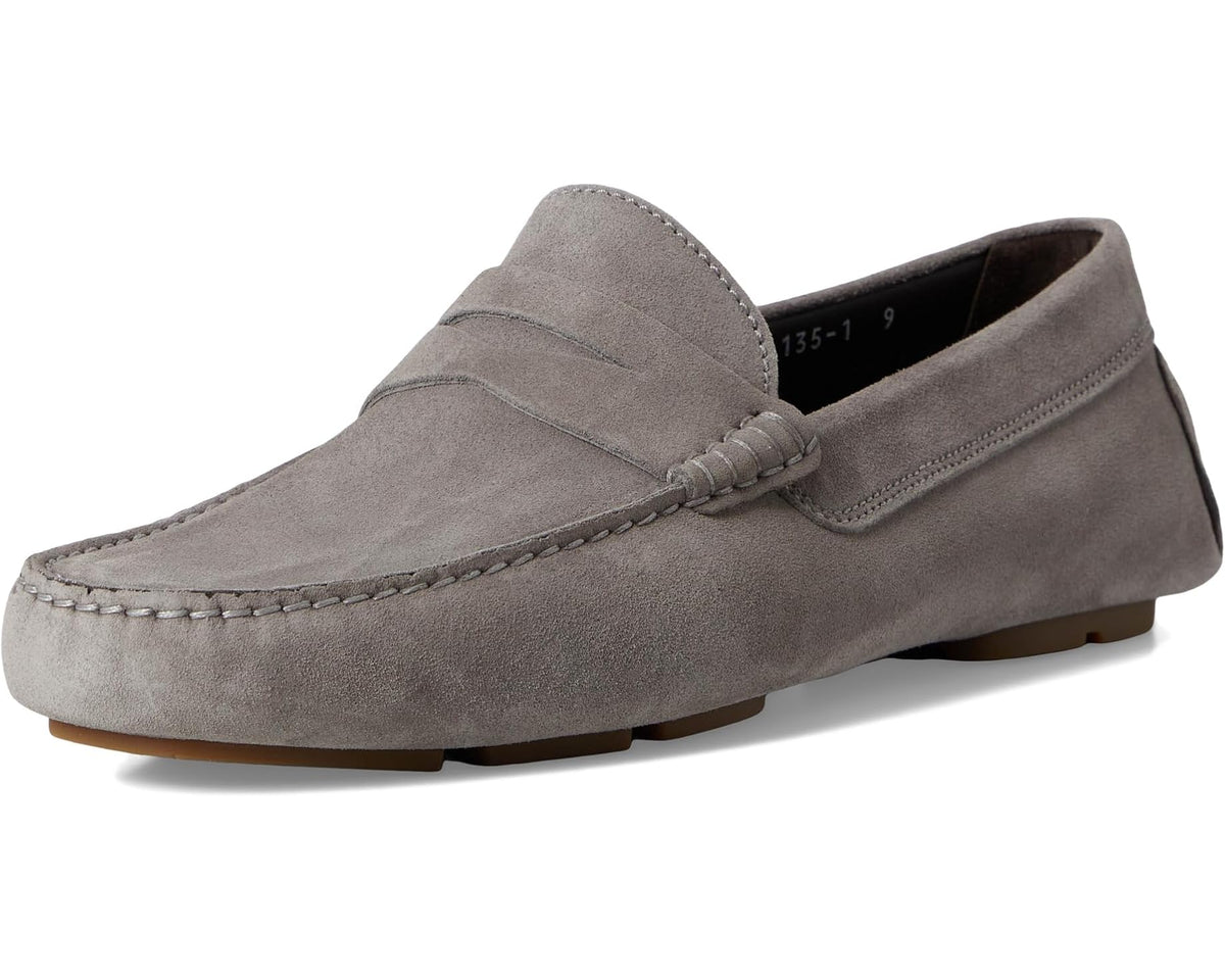 Grey suede men's loafer side view with moc stitching and low tan sole