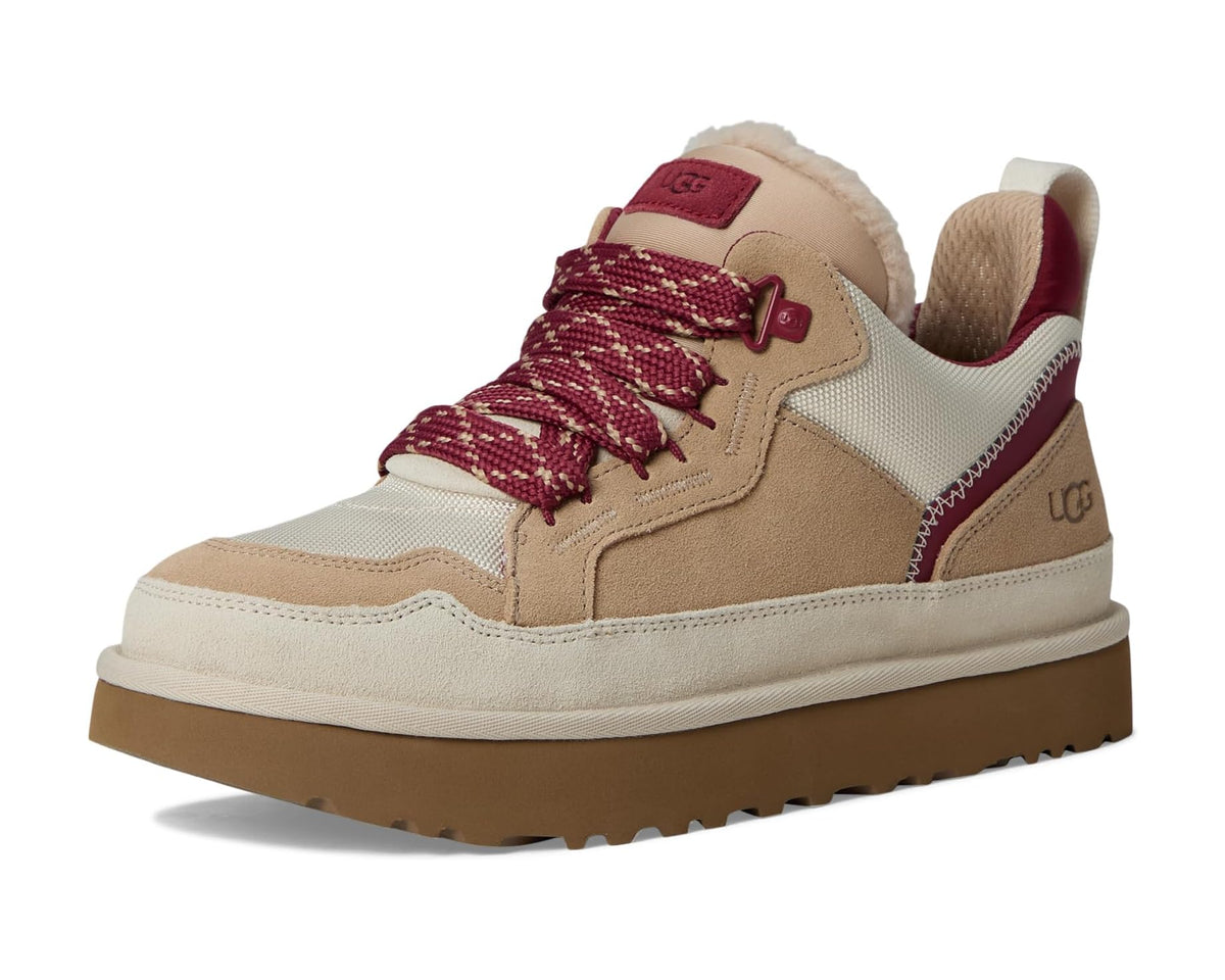 Men's UGG low-top sneakers, angled front view: tan upper with burgundy laces and rubber sole.