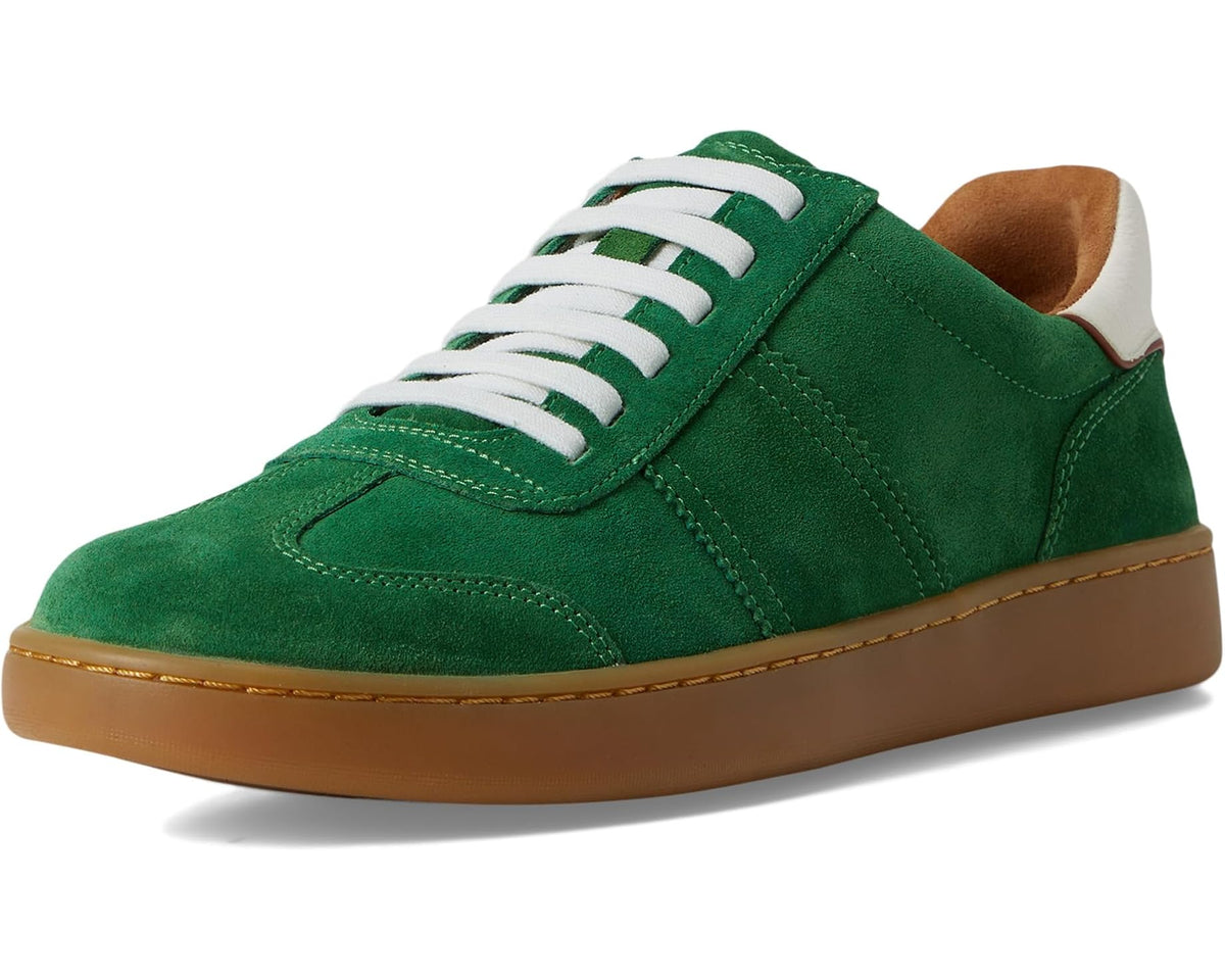 Green suede lace-up sneakers with white laces and tan rubber sole.