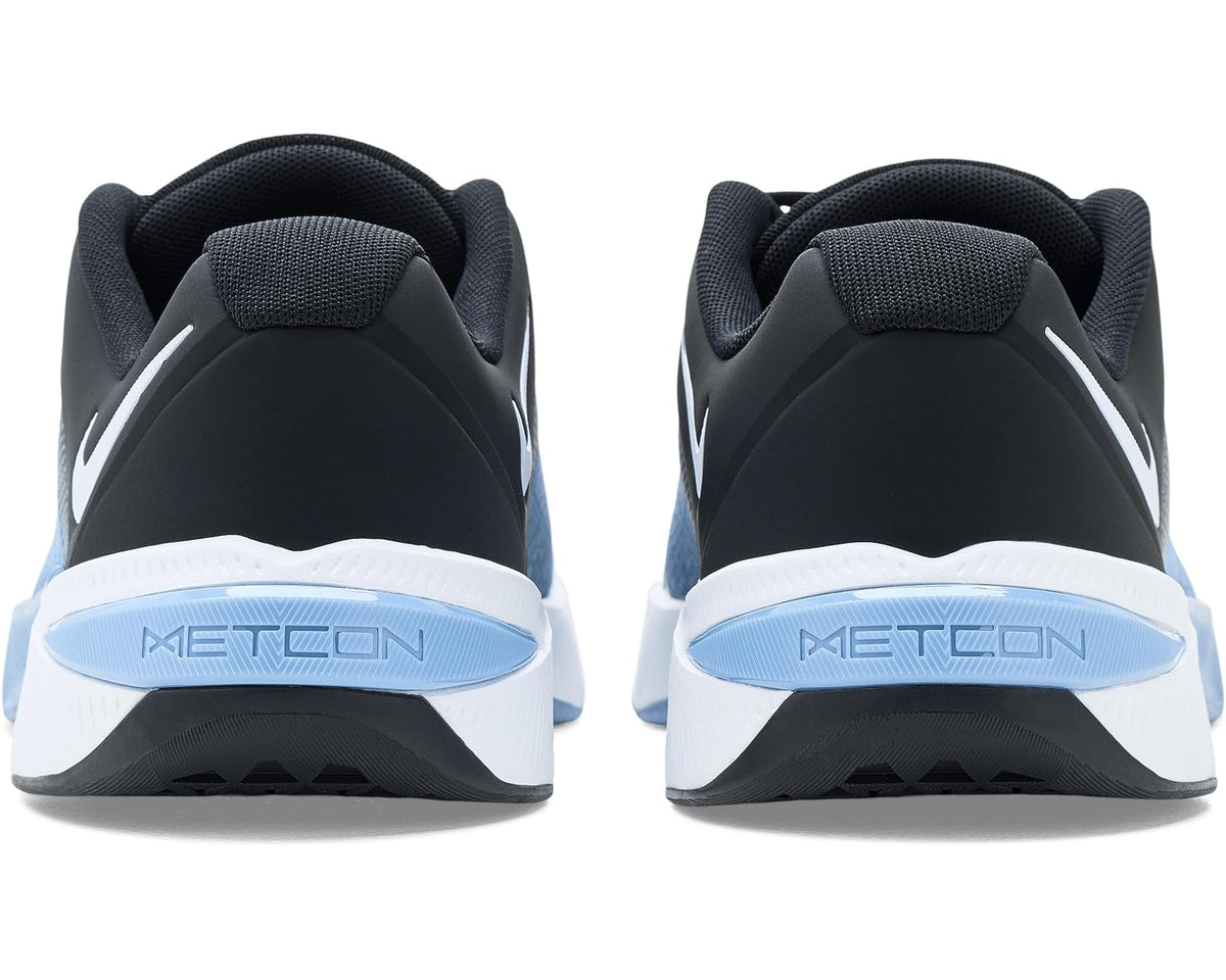 Men's training shoe heels with black collar, blue METCON heel tabs, white midsole.