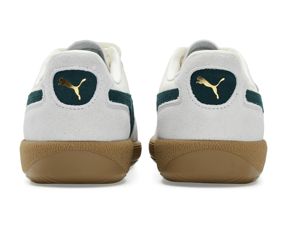 Back view of PUMA Palermo sneakers with dark green heel patch and gum midsole
