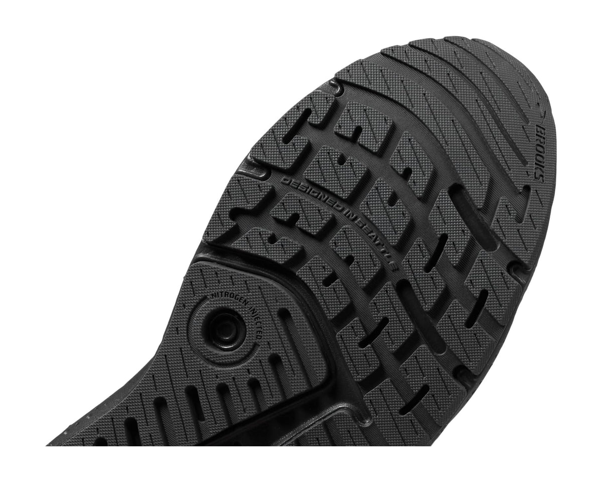 Men's running shoe outsole with deep tread and circular traction detail