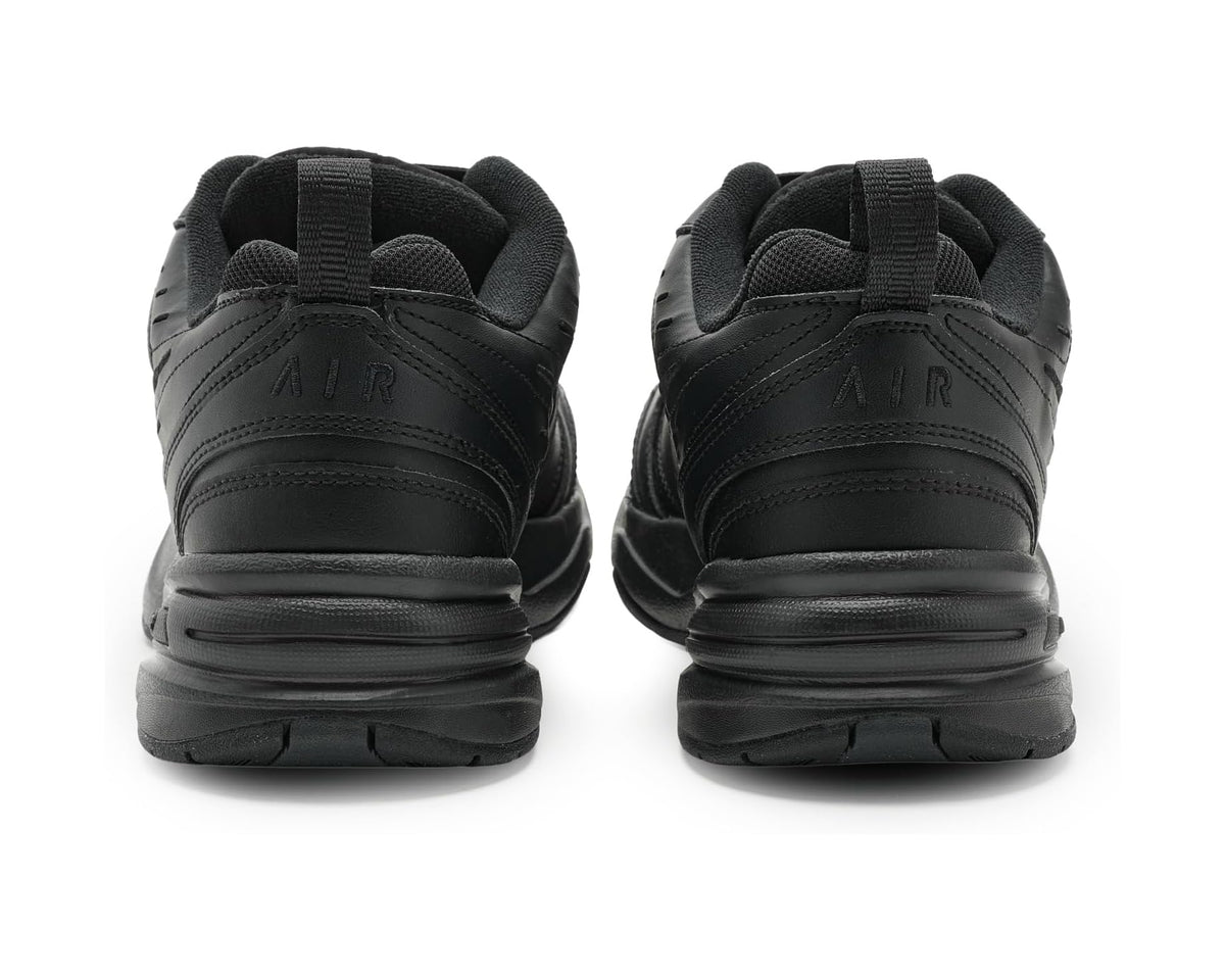 Black Nike sneakers from back view with Air Monarch heel branding.