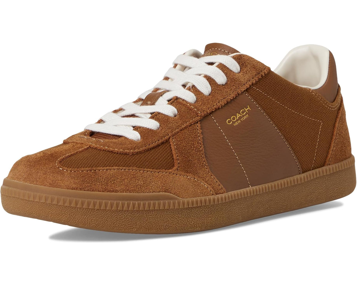 Men's COACH sneakers angled front view, white laces, brown upper, gum rubber sole