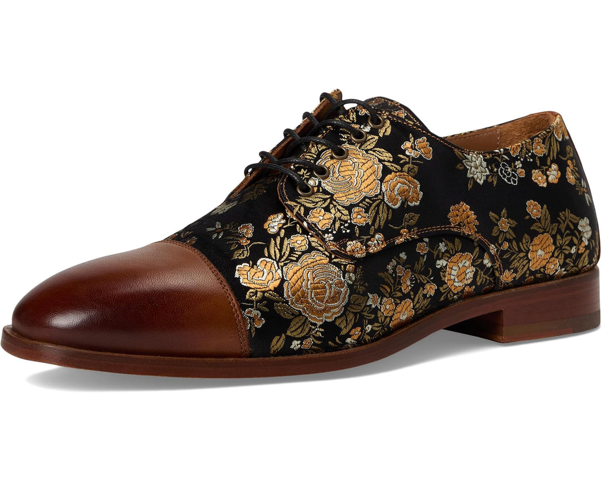 Men's jackshoe with brown leather toe, dark gold floral upper, lace-up low heel.