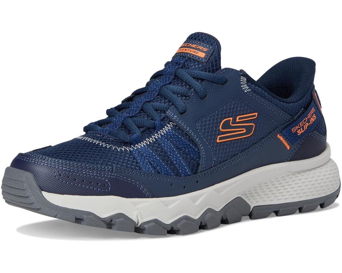 Men's navy slip-in athletic shoe with orange accents and thick gray traction outsole