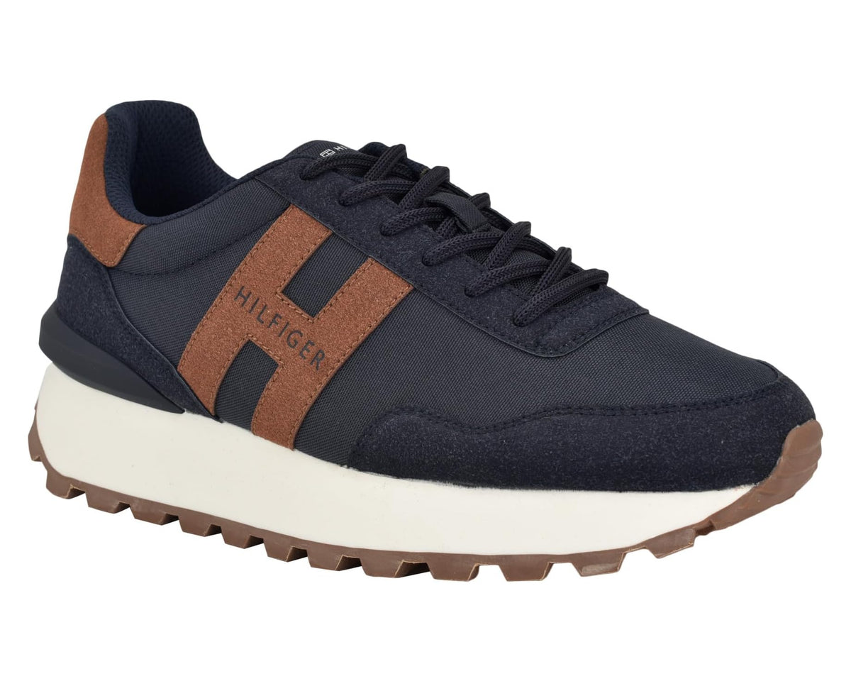 Men's navy and cognac lace-up sneaker, side 3/4 view with rugged tan sole