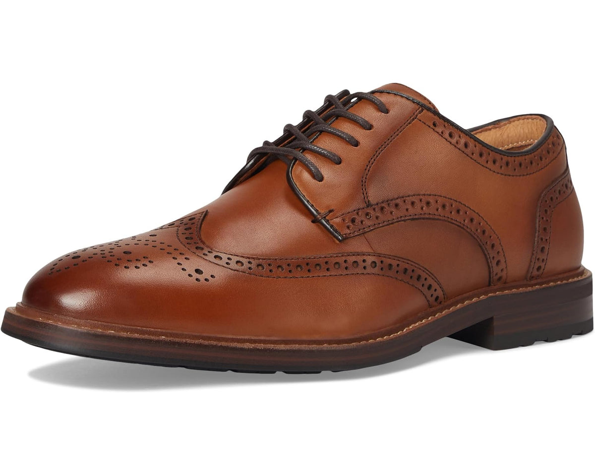 Men's saddle tan wingtip oxford shoes with brogue perforations and black lace-up