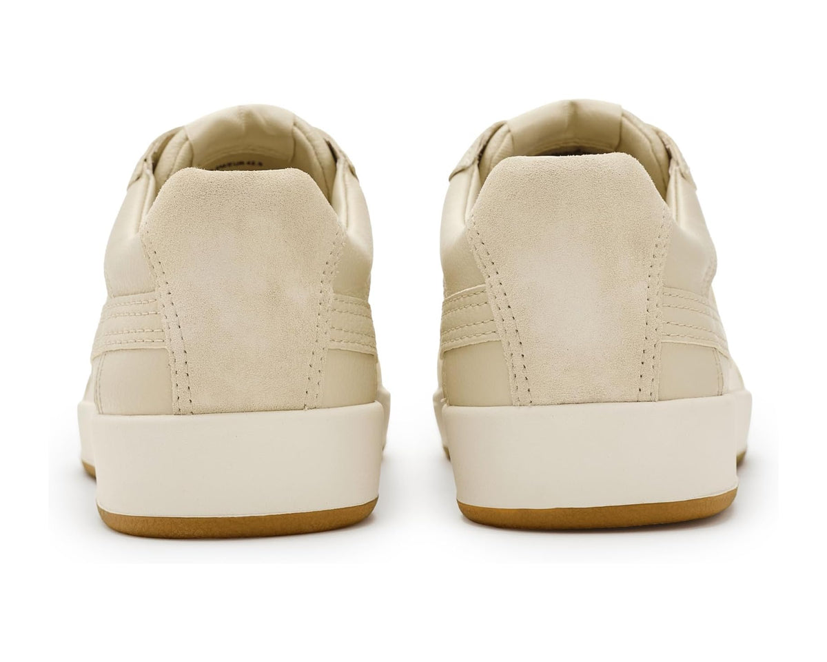 Vince men’s light beige sneakers viewed from heel with padded collar and gum outsole