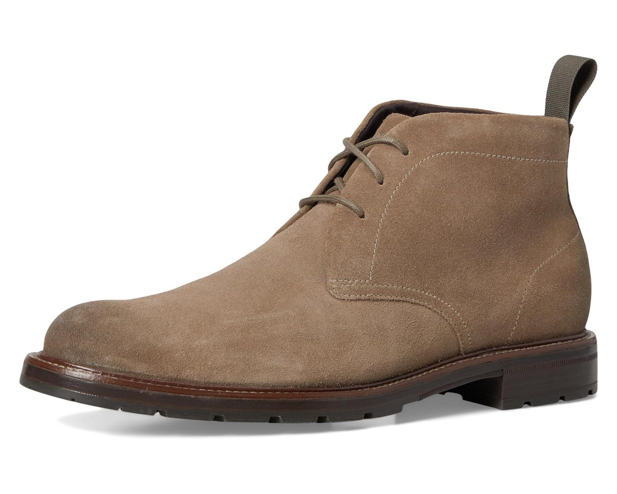 Men's suede chukka boots with lace-up closure, round toe, and pull tab at heel